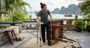 Sleek lightweight aluminum portable massage table inside a modern physical therapy clinic.