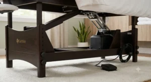 Close-up of the smooth motor and foot pedal mechanism on an electric lift massage table